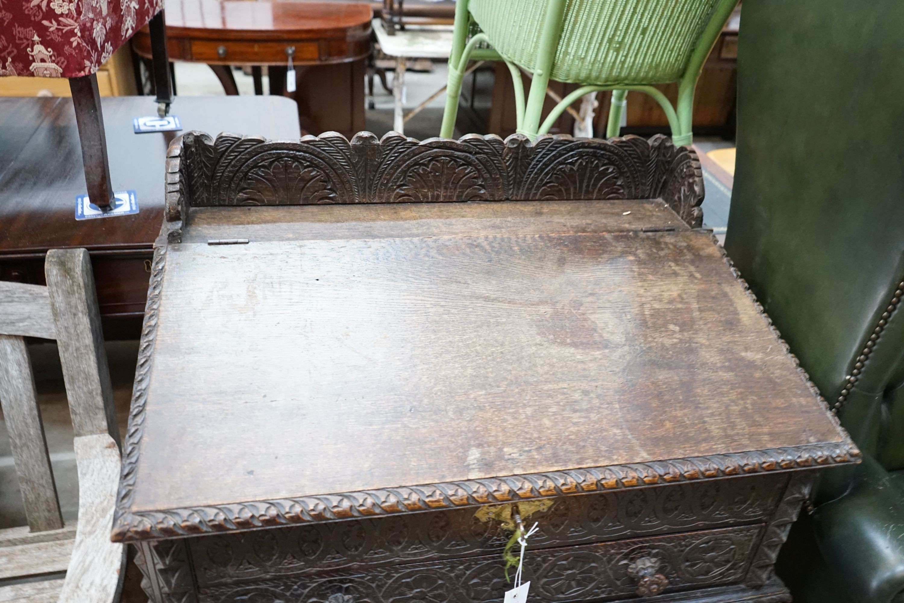 An Anglo-Indian carved oak desk, length 82cm, depth 53cm, height 103cm